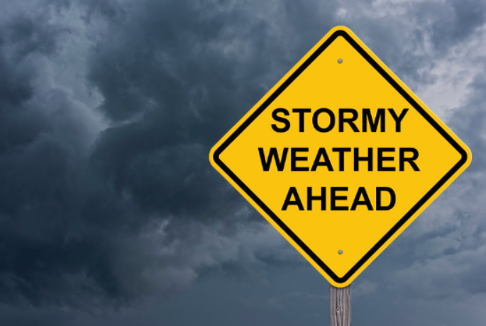 a street sign that says stormy weather ahead